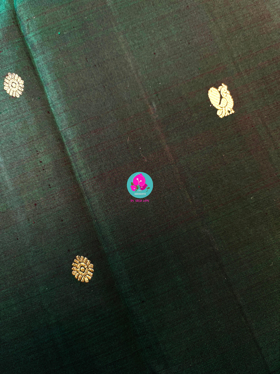 Vintage classic Kanchipattu saree in beautiful bottle green and purple Paired with hand embroidered blouse