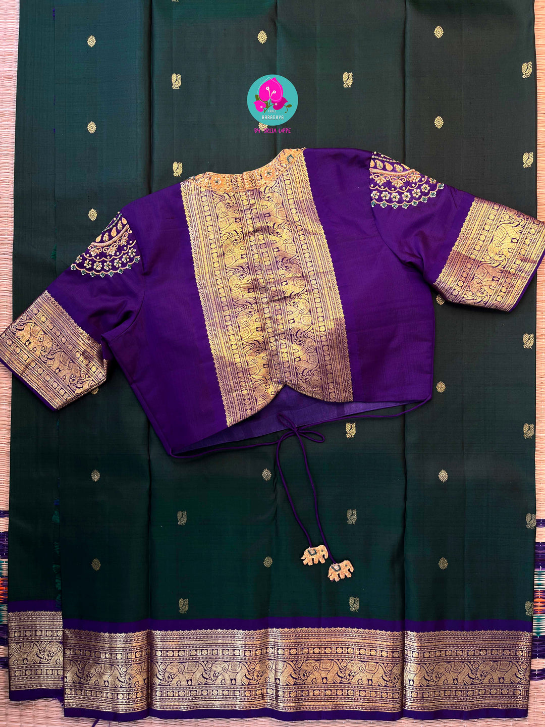 Vintage classic Kanchipattu saree in beautiful bottle green and purple Paired with hand embroidered blouse
