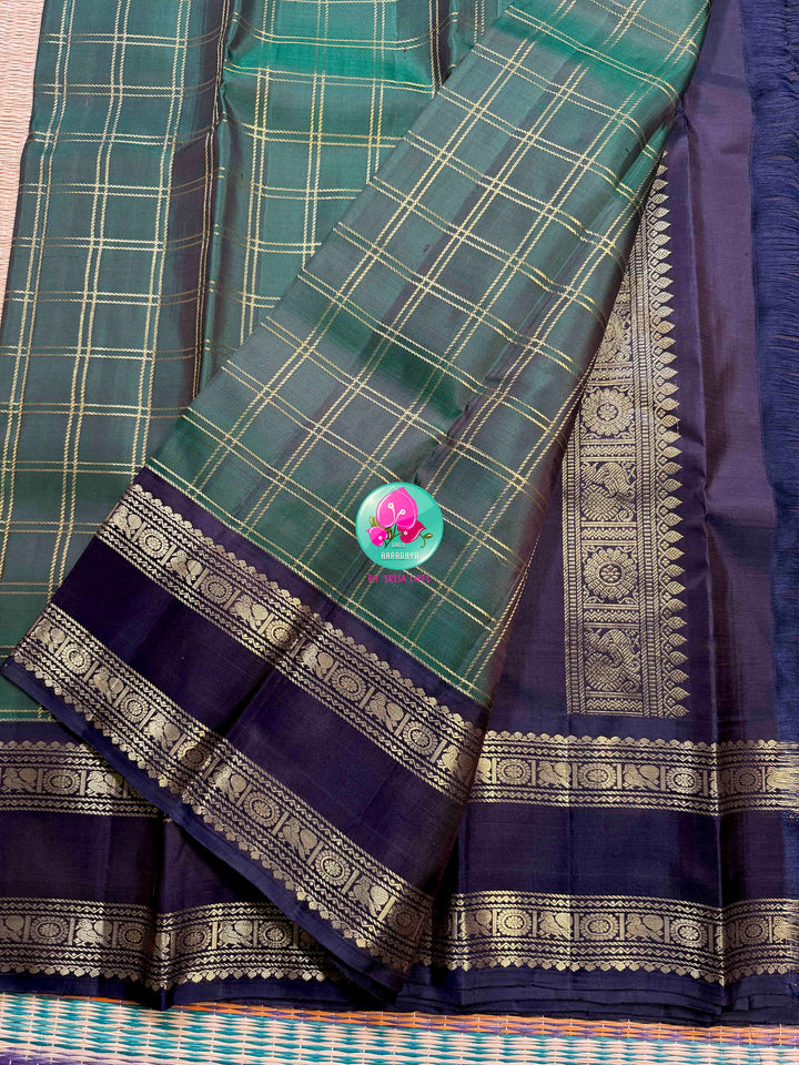 Emerald Checkmate: Bottle Green 2G Kanchipattu Saree with Sapphire Blue Contrast