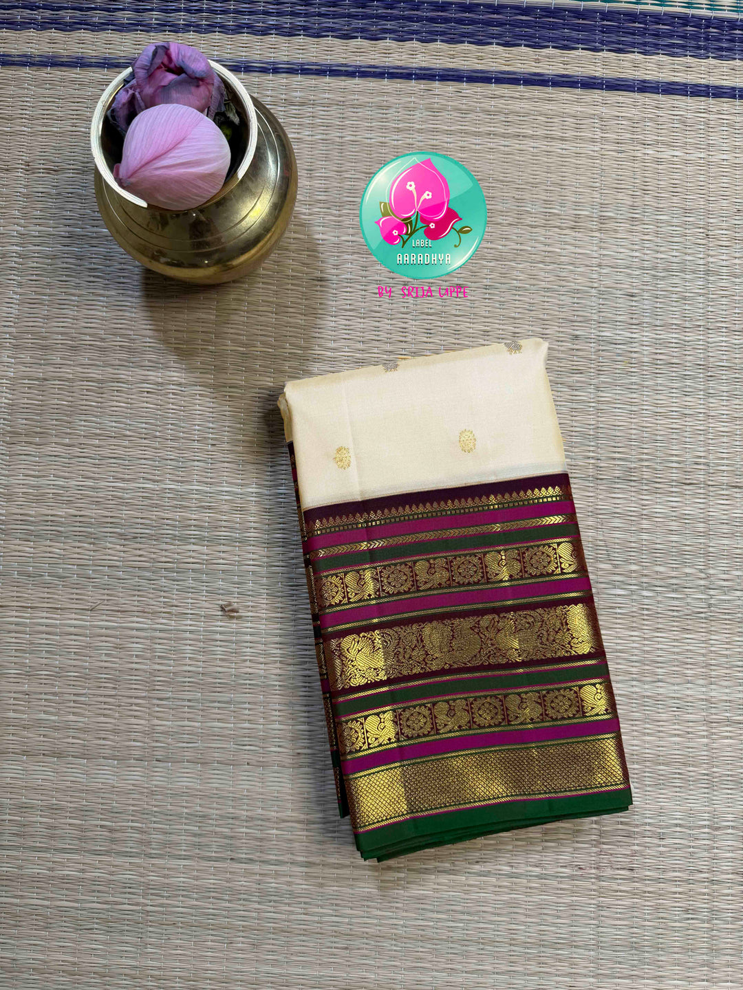 Ivory Grandeur: Off-white Kanchipattu with Zari-Kissed Pink, Maroon, and Green Border
