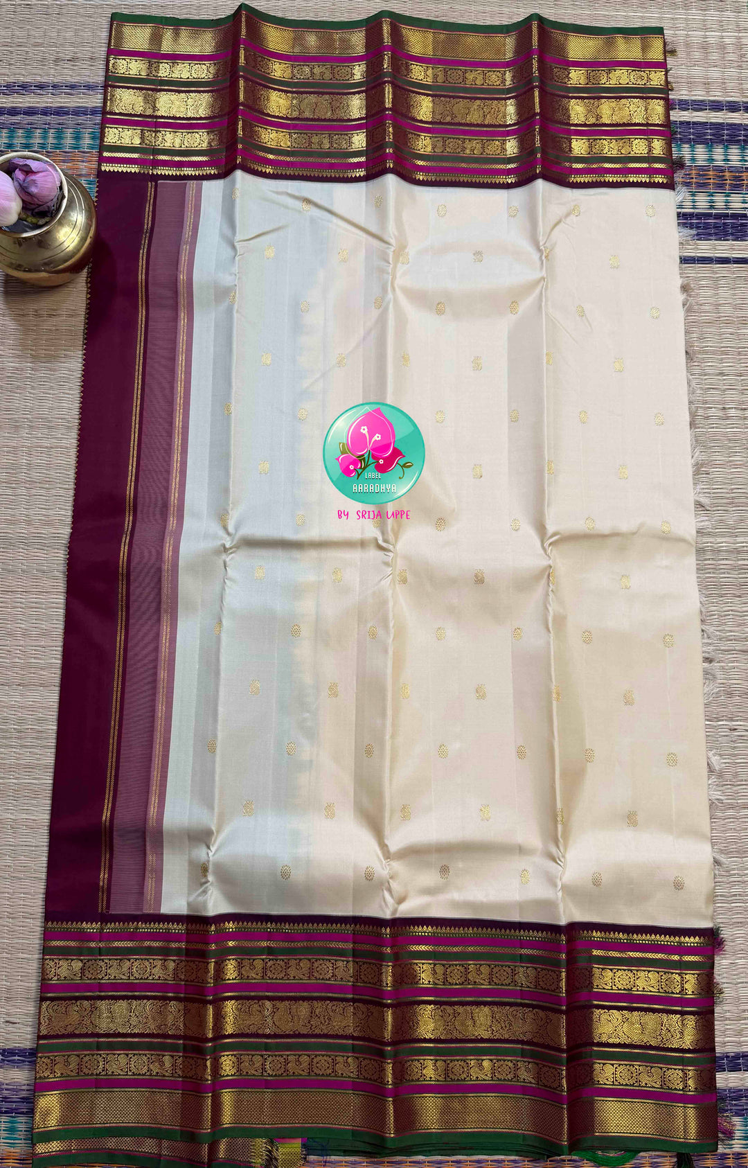 Ivory Grandeur: Off-white Kanchipattu with Zari-Kissed Pink, Maroon, and Green Border