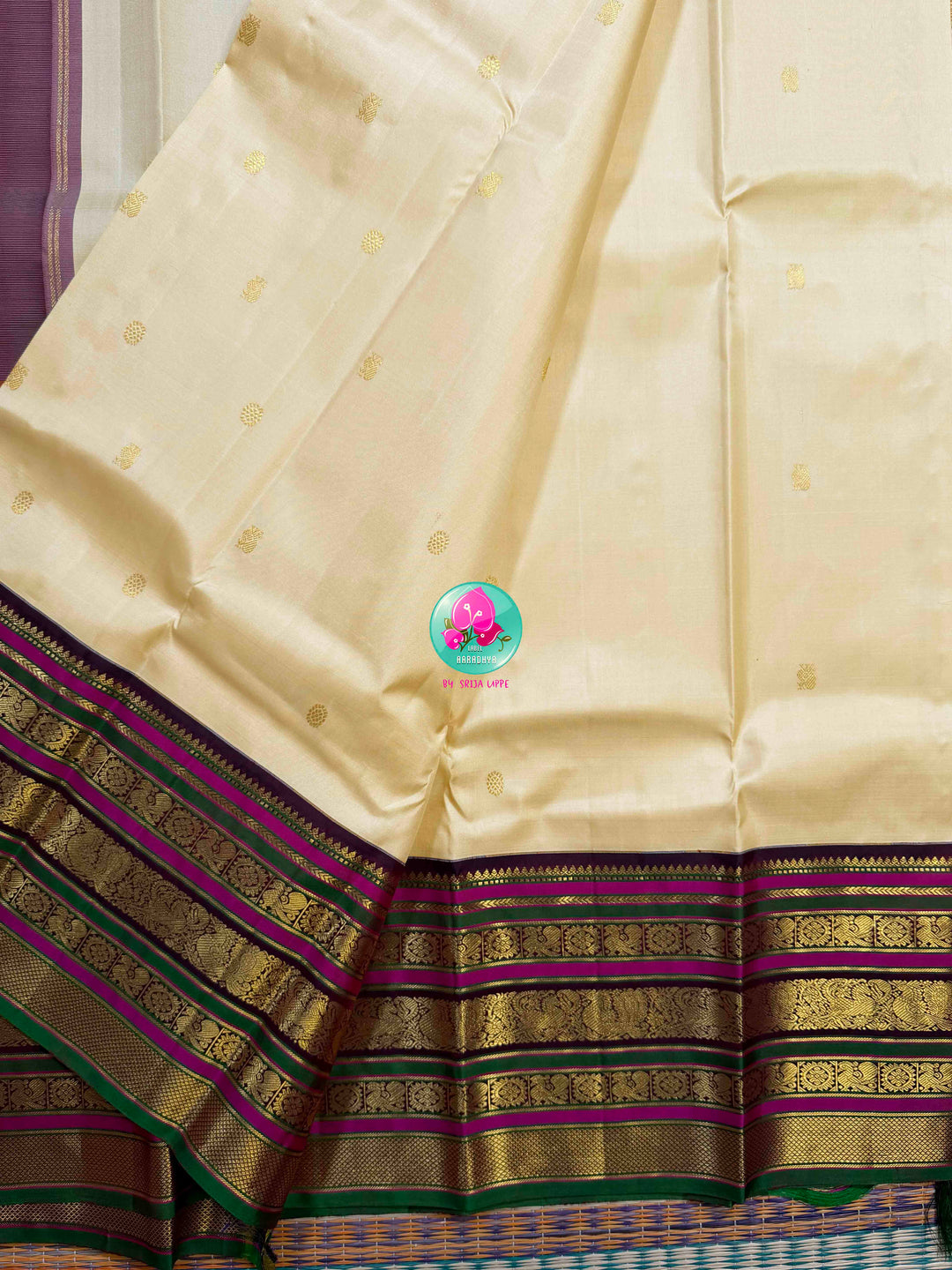 Ivory Grandeur: Off-white Kanchipattu with Zari-Kissed Pink, Maroon, and Green Border