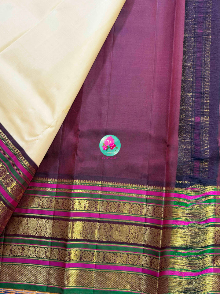 Ivory Grandeur: Off-white Kanchipattu with Zari-Kissed Pink, Maroon, and Green Border