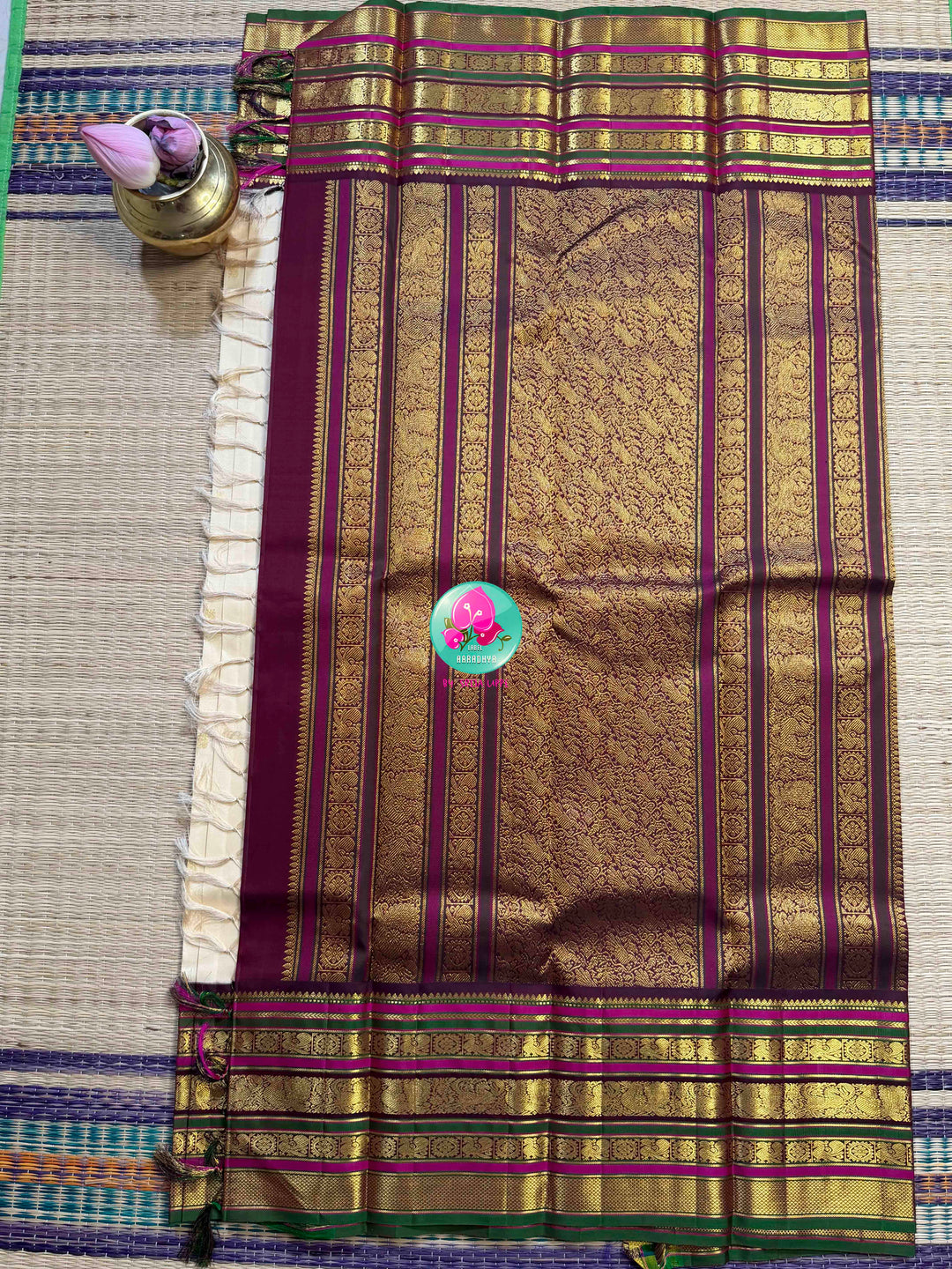 Ivory Grandeur: Off-white Kanchipattu with Zari-Kissed Pink, Maroon, and Green Border