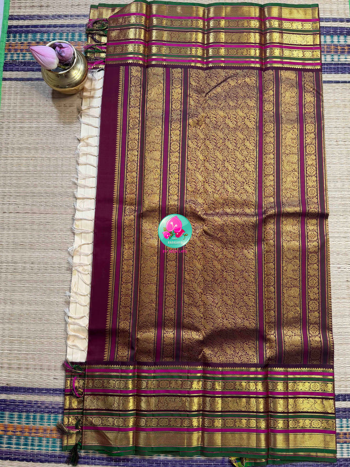 Ivory Grandeur: Off-white Kanchipattu with Zari-Kissed Pink, Maroon, and Green Border