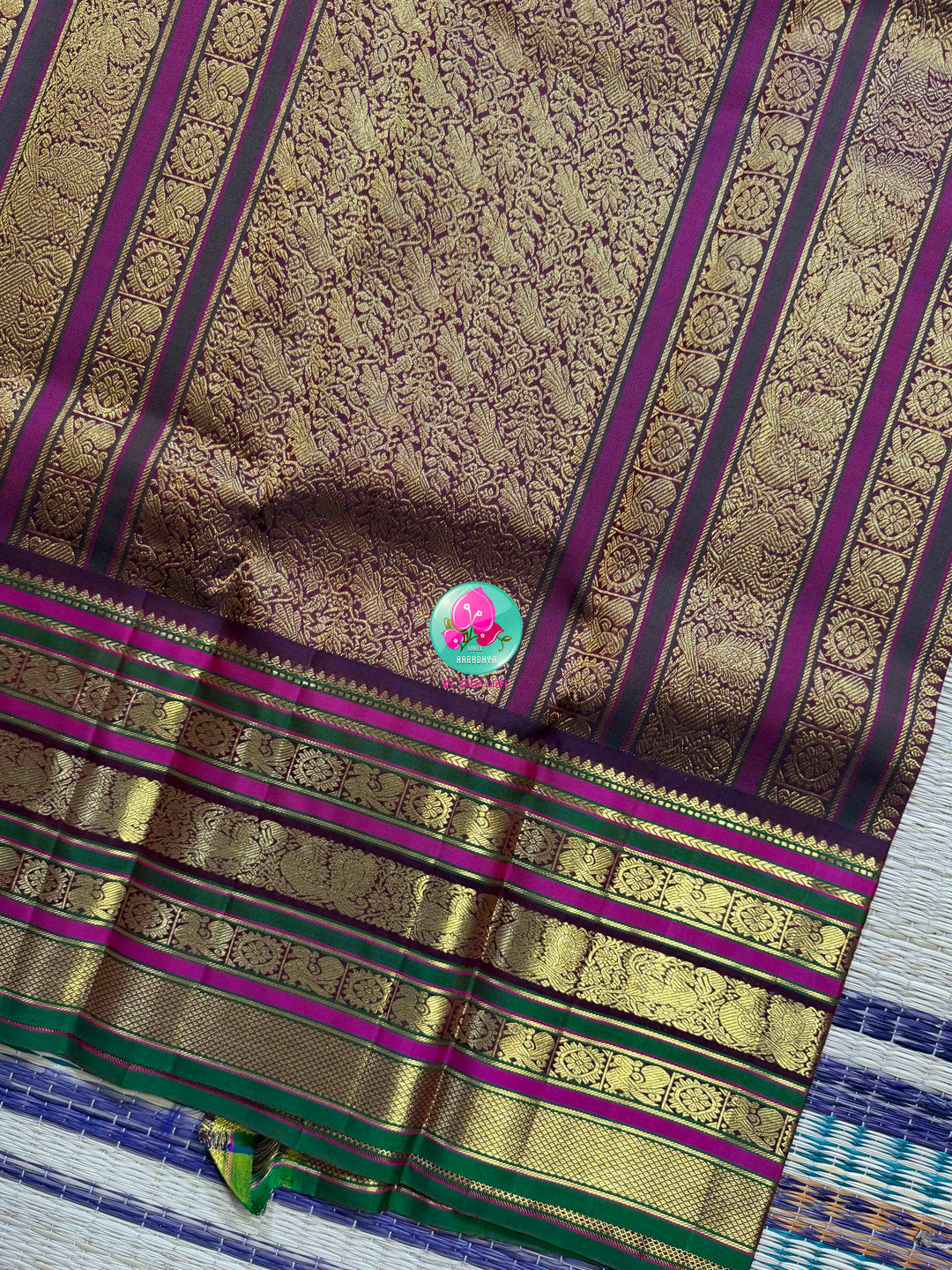 Ivory Grandeur: Off-white Kanchipattu with Zari-Kissed Pink, Maroon, and Green Border