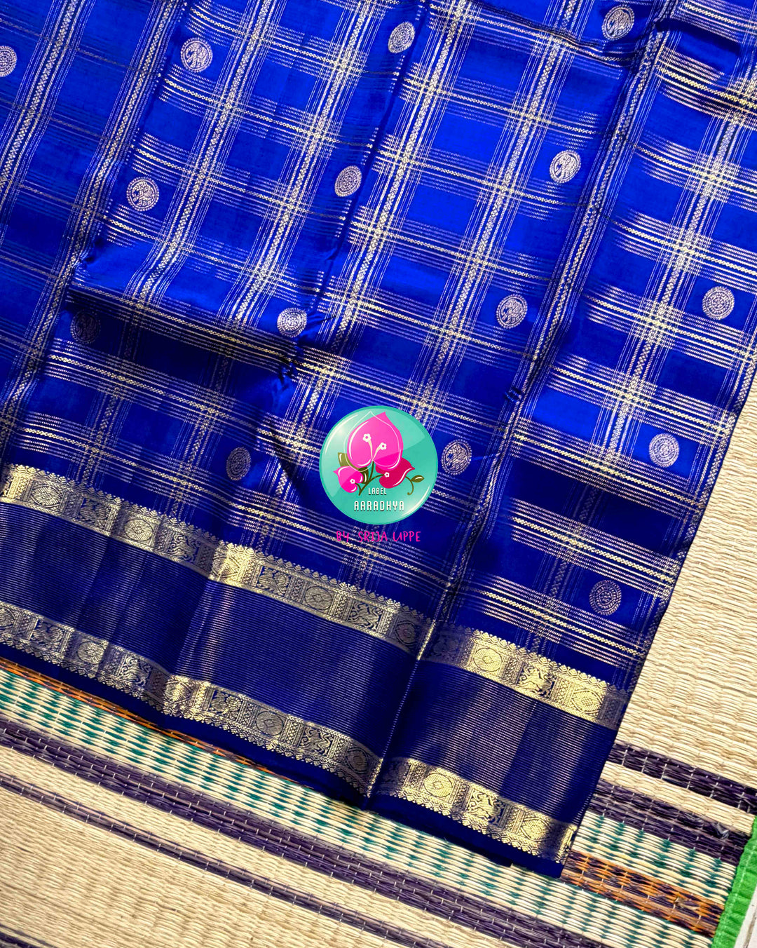 Sapphire Lattice: Classic Royal Blue Checked Kanchipattu saree with a Vaira Oosi Twist