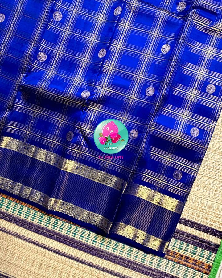 Sapphire Lattice: Classic Royal Blue Checked Kanchipattu saree with a Vaira Oosi Twist