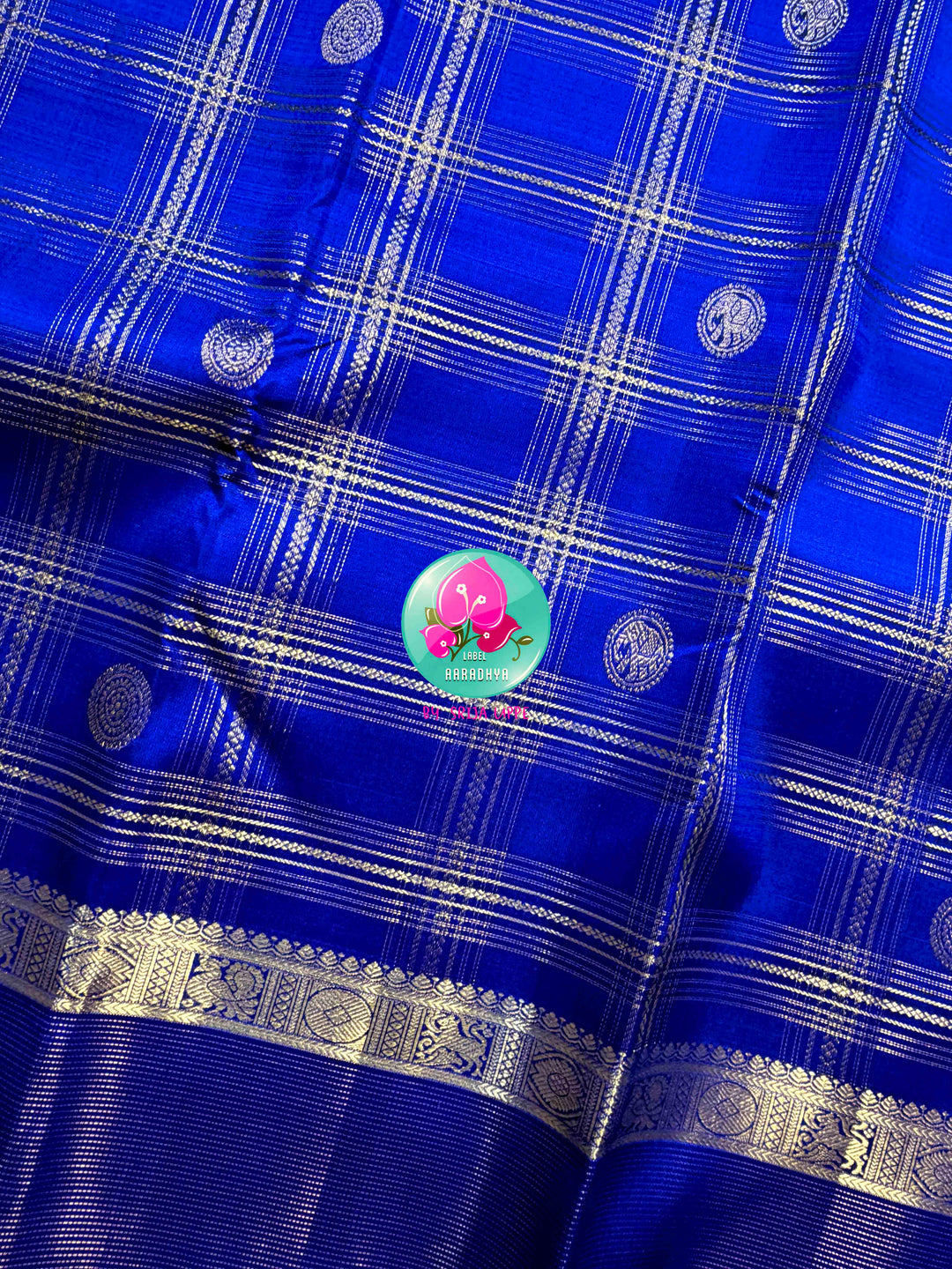Sapphire Lattice: Classic Royal Blue Checked Kanchipattu saree with a Vaira Oosi Twist