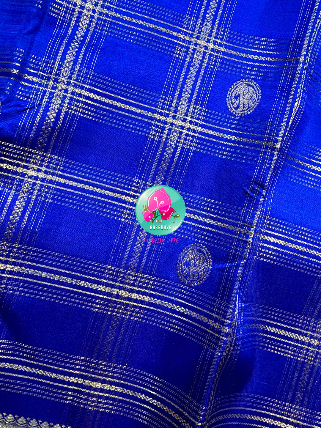 Sapphire Lattice: Classic Royal Blue Checked Kanchipattu saree with a Vaira Oosi Twist