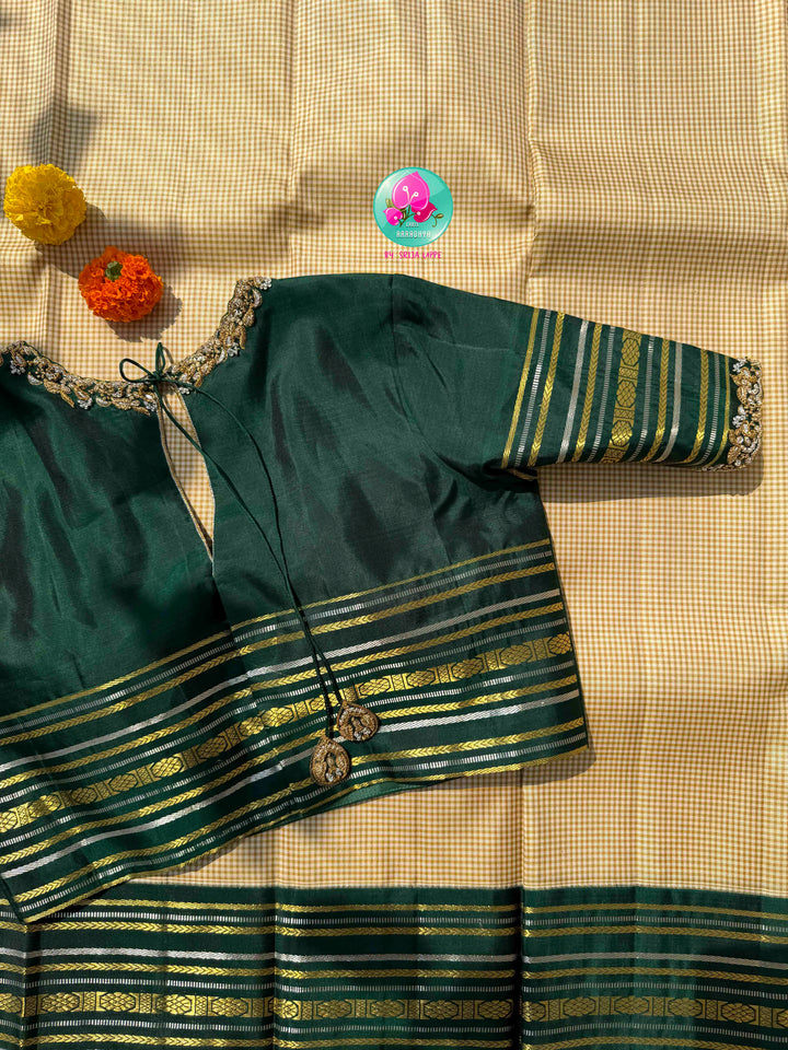 Dual-Metallic Heritage Splendor: Classy Beige Madras Checkered Saree with Bottle Green Border & Hand-Embroidered Maggam Blouse