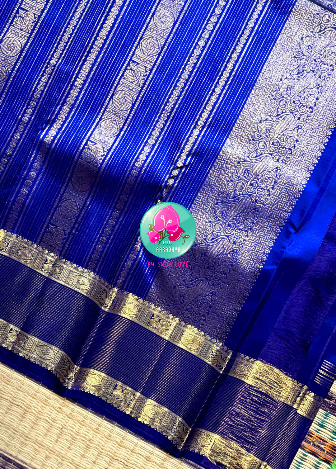 Sapphire Lattice: Classic Royal Blue Checked Kanchipattu saree with a Vaira Oosi Twist