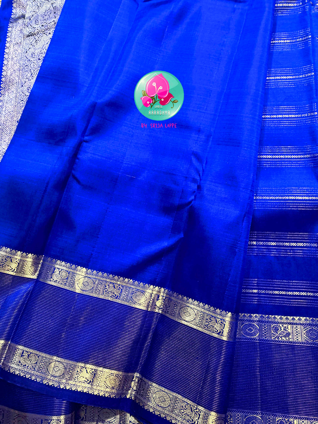 Sapphire Lattice: Classic Royal Blue Checked Kanchipattu saree with a Vaira Oosi Twist