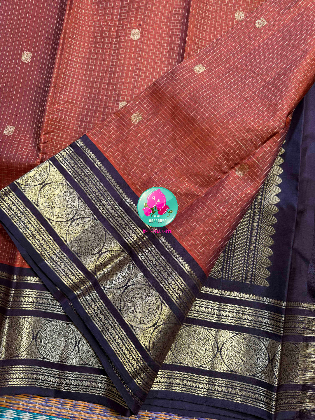 Autumn’s Anthem: Rust Orange Kanchipattu saree with the Majestic Elephant Border