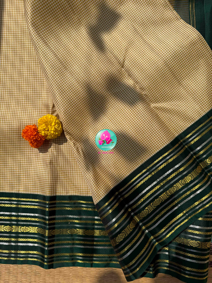 Dual-Metallic Heritage Splendor: Classy Beige Madras Checkered Saree with Bottle Green Border & Hand-Embroidered Maggam Blouse