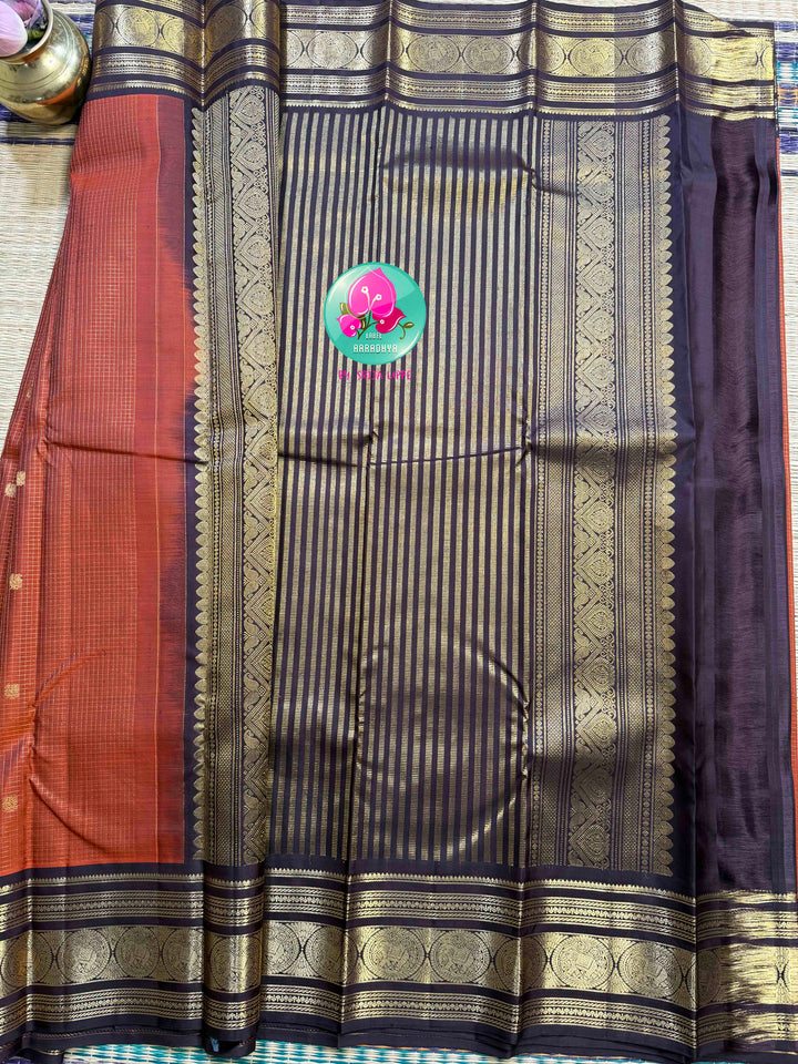 Autumn’s Anthem: Rust Orange Kanchipattu saree with the Majestic Elephant Border