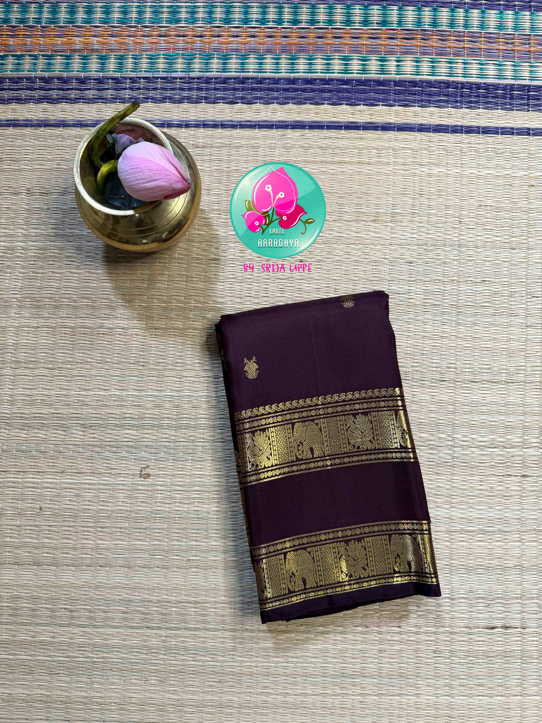 Trendy Brown Kanchipattu silk Saree with Commanding Gandaberunda Motifs