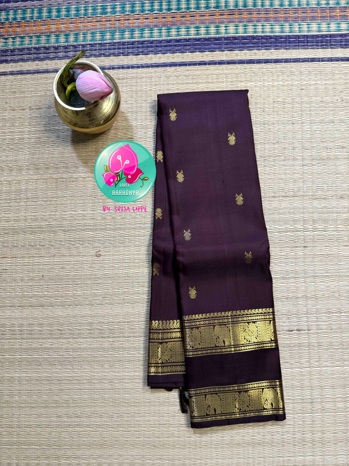 Trendy Brown Kanchipattu silk Saree with Commanding Gandaberunda Motifs