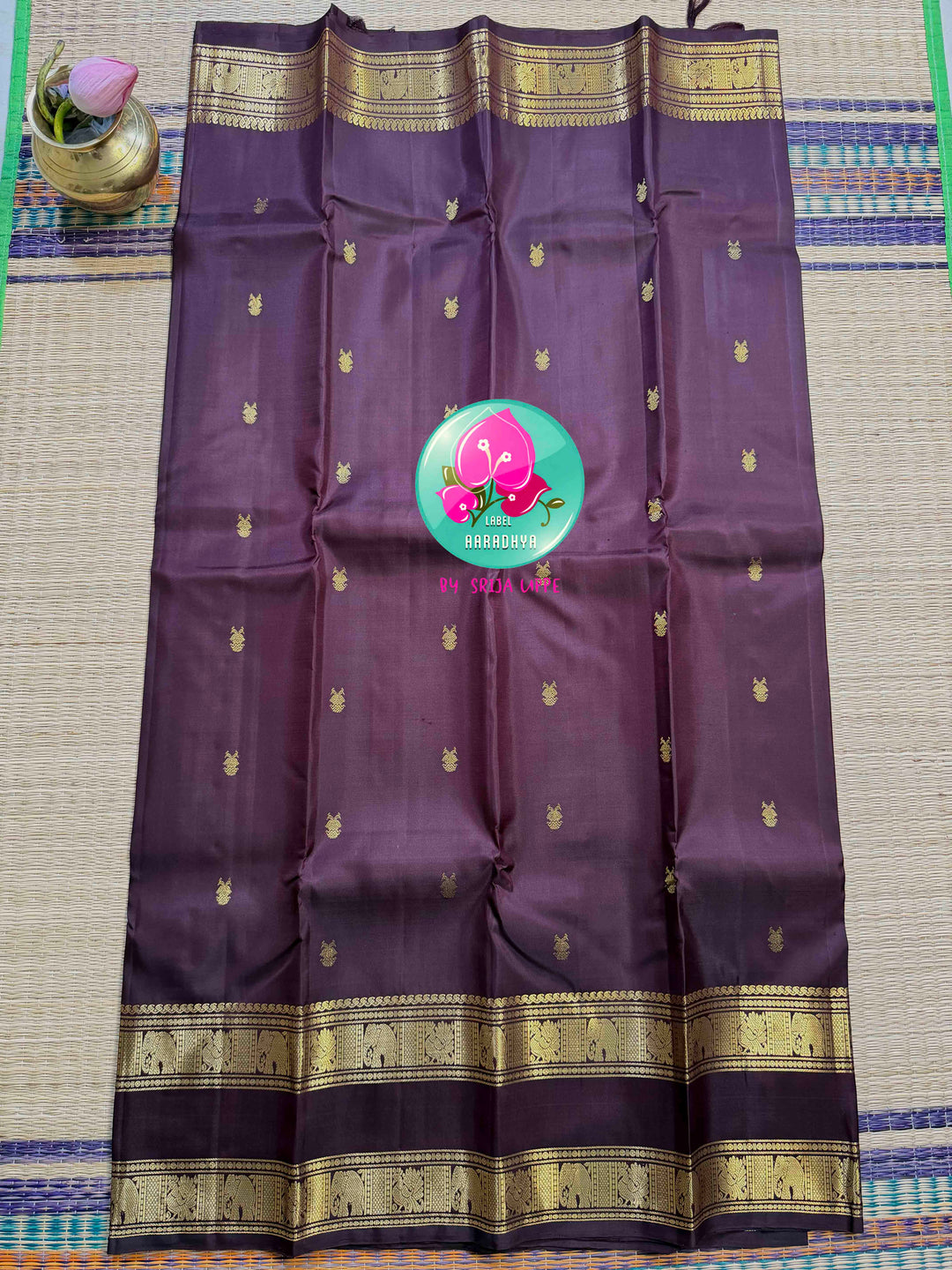 Trendy Brown Kanchipattu silk Saree with Commanding Gandaberunda Motifs