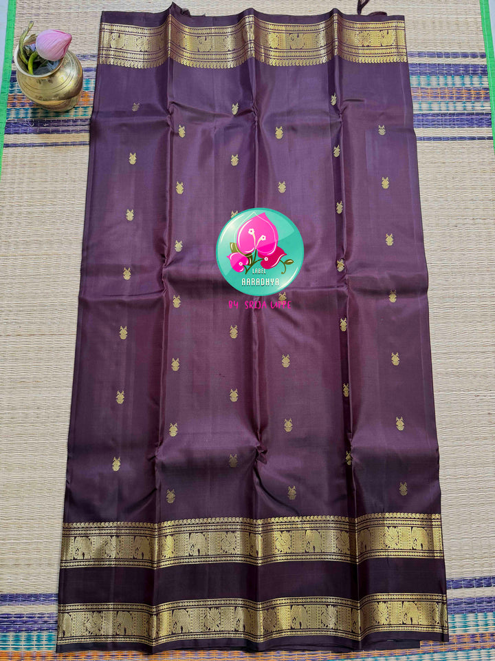 Trendy Brown Kanchipattu silk Saree with Commanding Gandaberunda Motifs