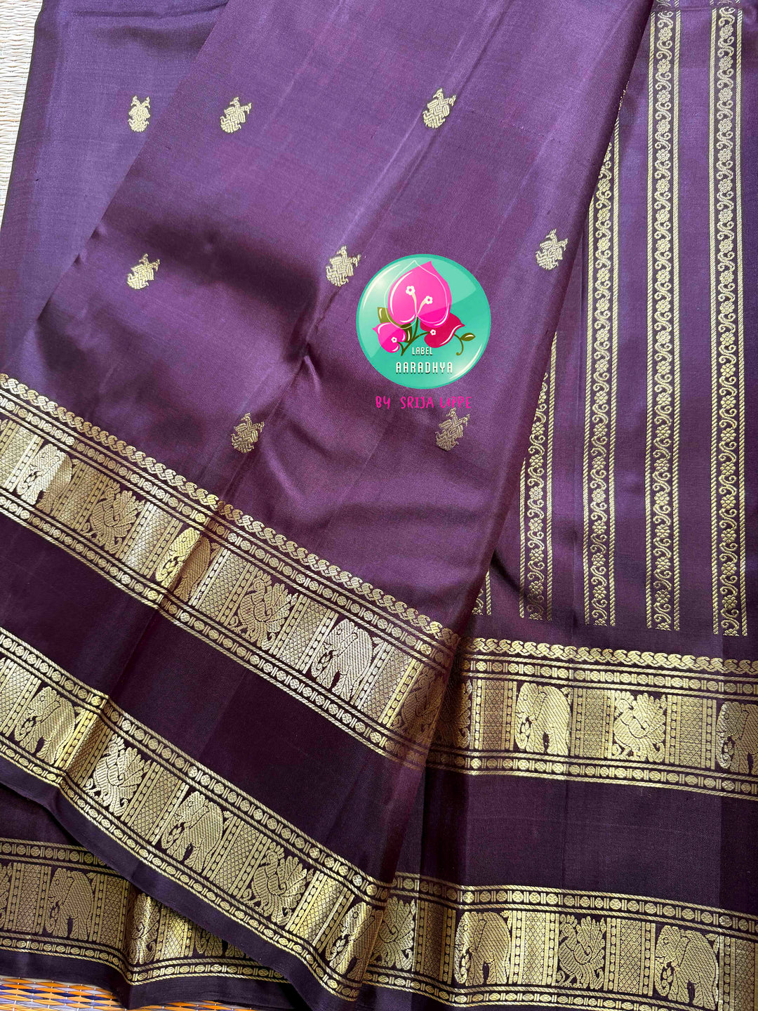 Trendy Brown Kanchipattu silk Saree with Commanding Gandaberunda Motifs