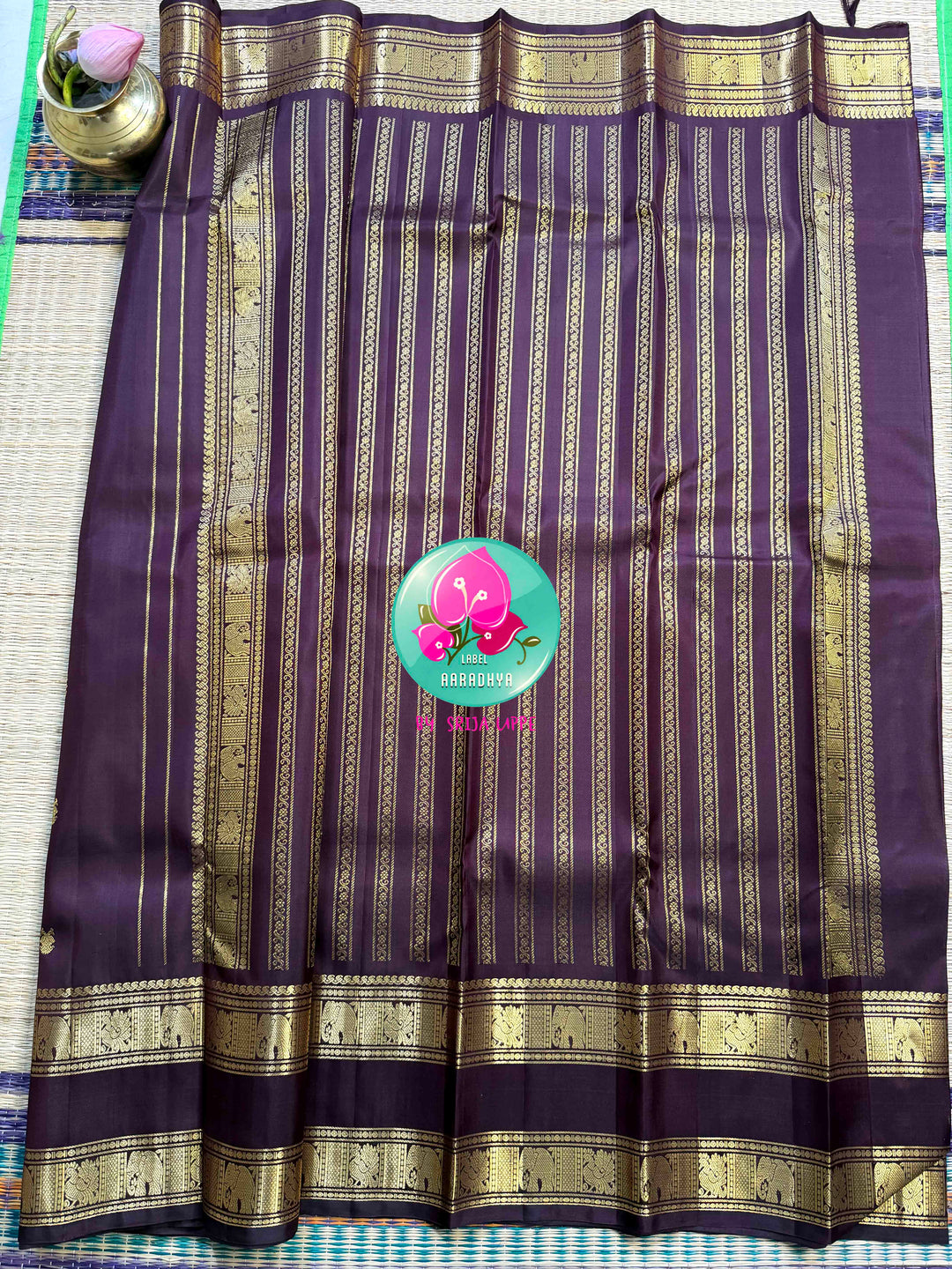 Trendy Brown Kanchipattu silk Saree with Commanding Gandaberunda Motifs