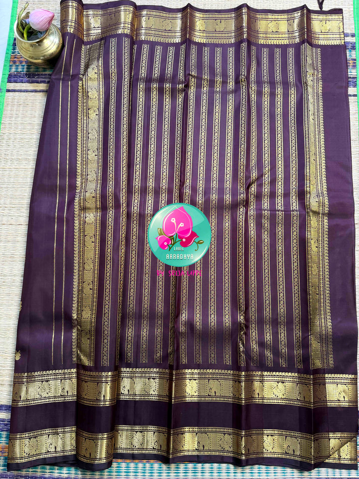 Trendy Brown Kanchipattu silk Saree with Commanding Gandaberunda Motifs