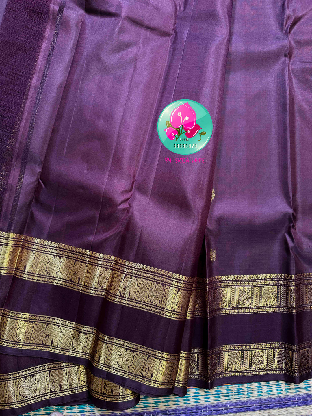 Trendy Brown Kanchipattu silk Saree with Commanding Gandaberunda Motifs