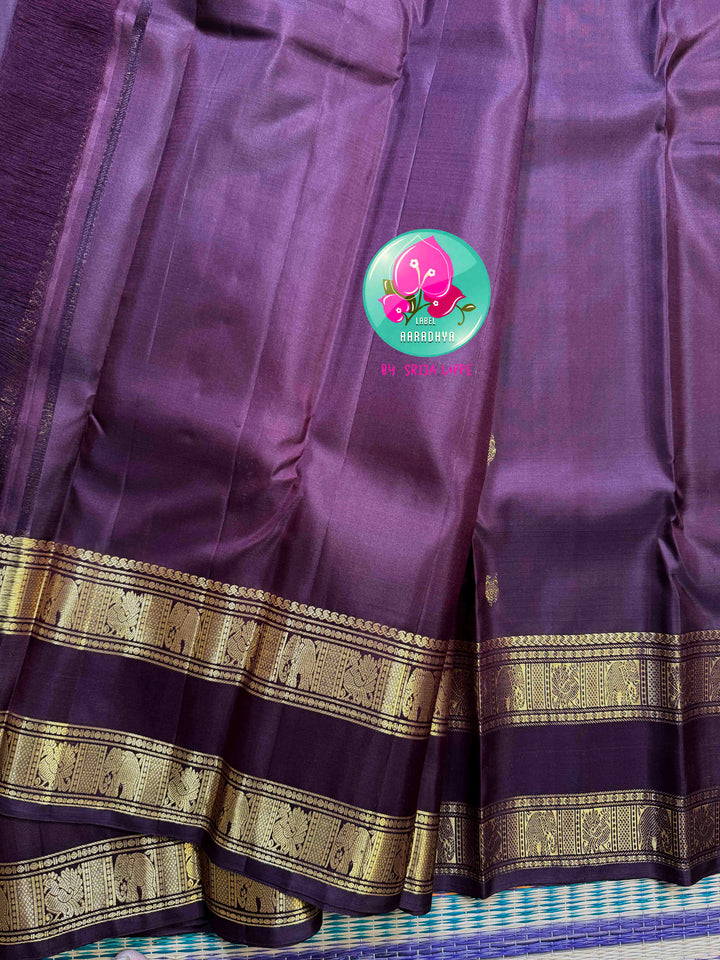 Trendy Brown Kanchipattu silk Saree with Commanding Gandaberunda Motifs