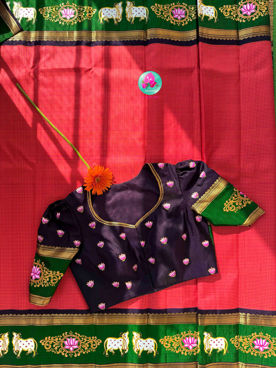 Sacred Pichwai Artistry & Sunset Radiance: Reddish-Orange Mini Checks Pure Kanjeevaram Saree with Hand-Painted Plum Blouse