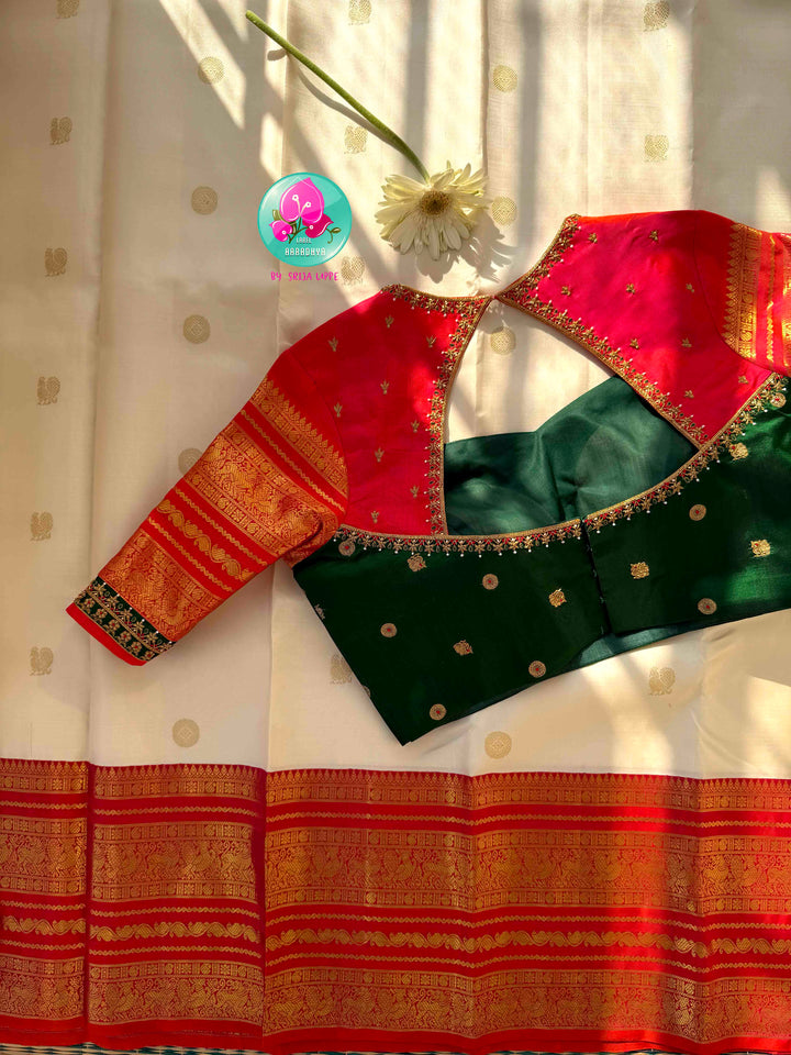 Divine Temple Grandeur: Pure Off-White & Crimson Red Kanjeevaram Silk Saree with Hand-Embroidered Emerald Fusion Blouse