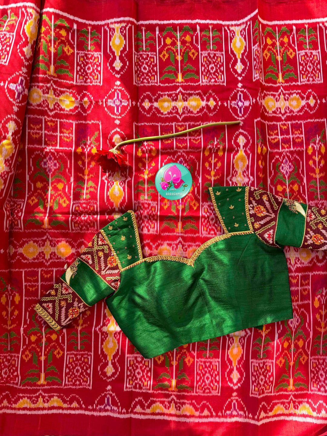 Heirloom Heritage & Regal Valour: 5-Ply Crimson Red Rajkot Patola Silk Saree with Hand-Embroidered Puligoru Emerald Green Raw Silk Blouse