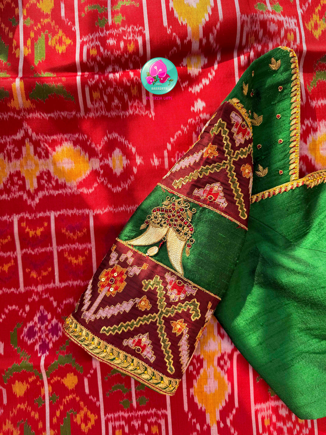 Heirloom Heritage & Regal Valour: 5-Ply Crimson Red Rajkot Patola Silk Saree with Hand-Embroidered Puligoru Emerald Green Raw Silk Blouse