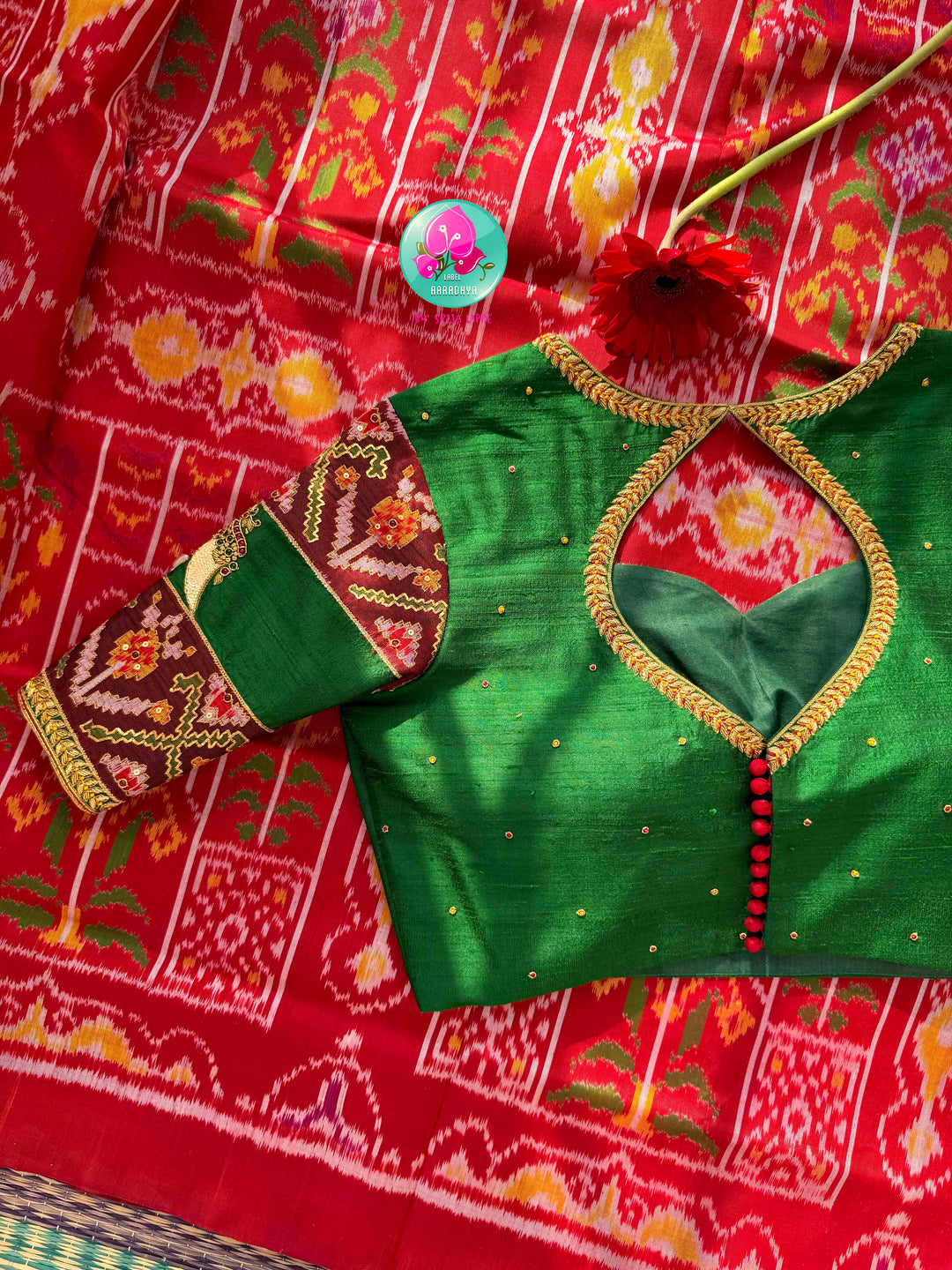 Heirloom Heritage & Regal Valour: 5-Ply Crimson Red Rajkot Patola Silk Saree with Hand-Embroidered Puligoru Emerald Green Raw Silk Blouse