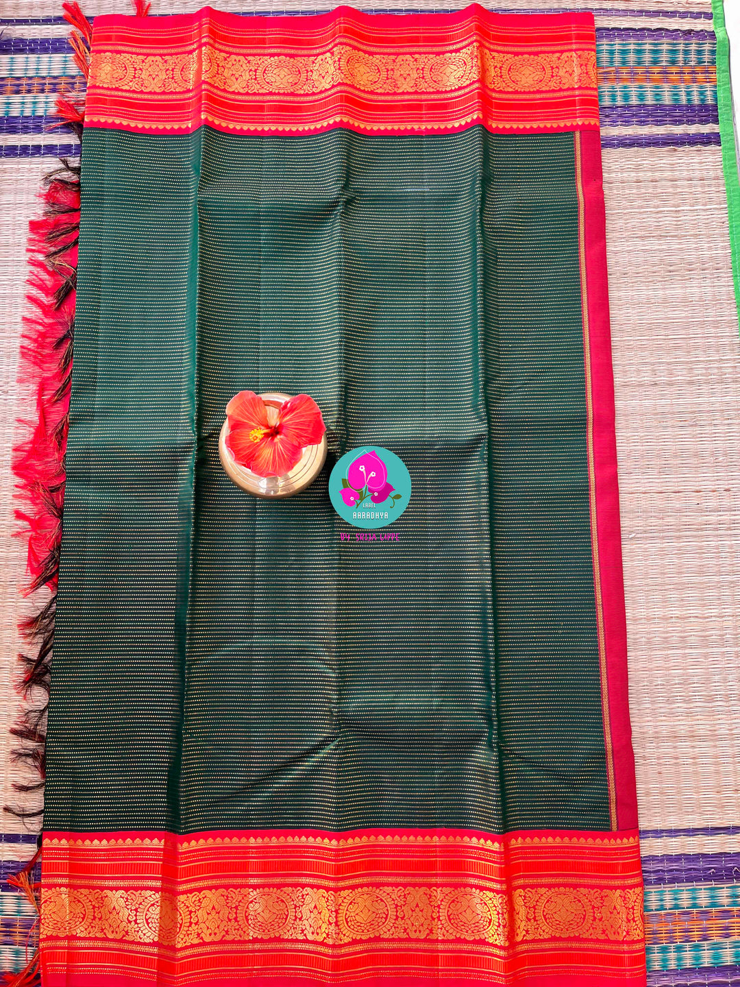Regal Serenity: Deep Green Kanjivaram saree with Fiery Red Contrast Blouse