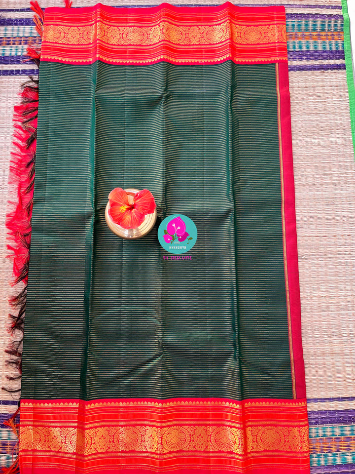 Regal Serenity: Deep Green Kanjivaram saree with Fiery Red Contrast Blouse