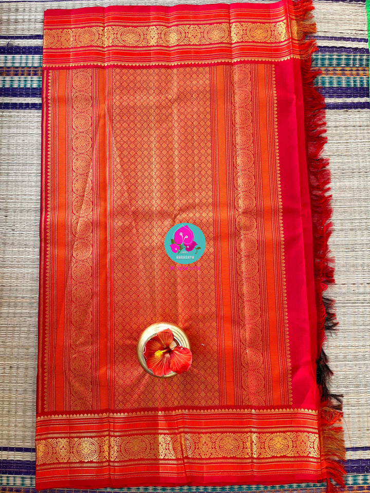 Regal Serenity: Deep Green Kanjivaram saree with Fiery Red Contrast Blouse