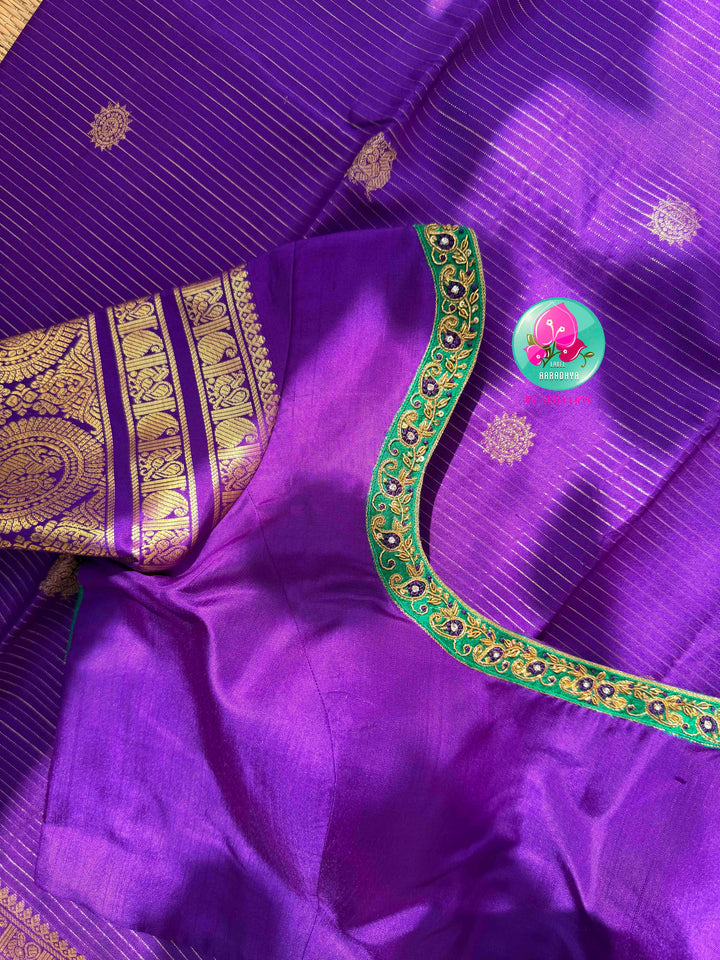 Monochromatic Imperial Majesty: Pure Royal Purple Kanjeevaram Silk Saree with Vaira Oosi Weave & Emerald-Trimmed Maggam Blouse