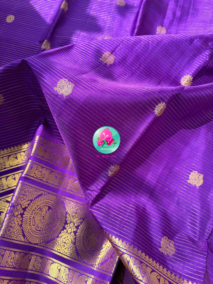 Monochromatic Imperial Majesty: Pure Royal Purple Kanjeevaram Silk Saree with Vaira Oosi Weave & Emerald-Trimmed Maggam Blouse