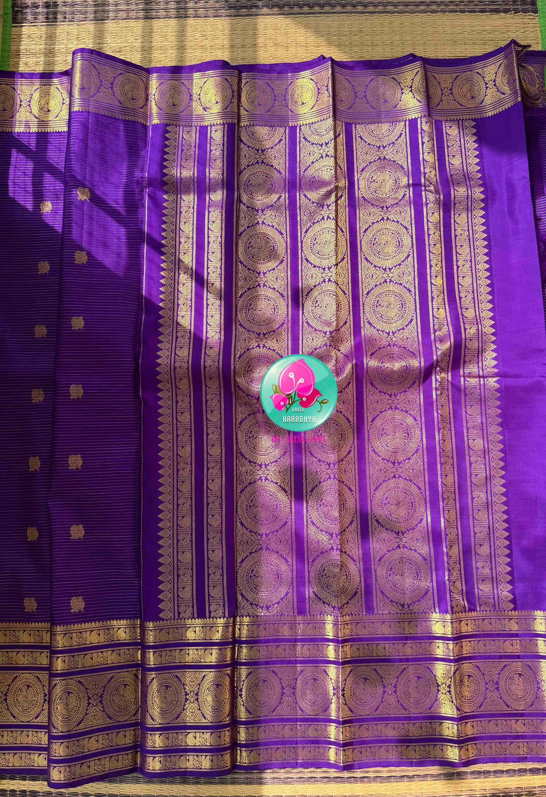 Monochromatic Imperial Majesty: Pure Royal Purple Kanjeevaram Silk Saree with Vaira Oosi Weave & Emerald-Trimmed Maggam Blouse