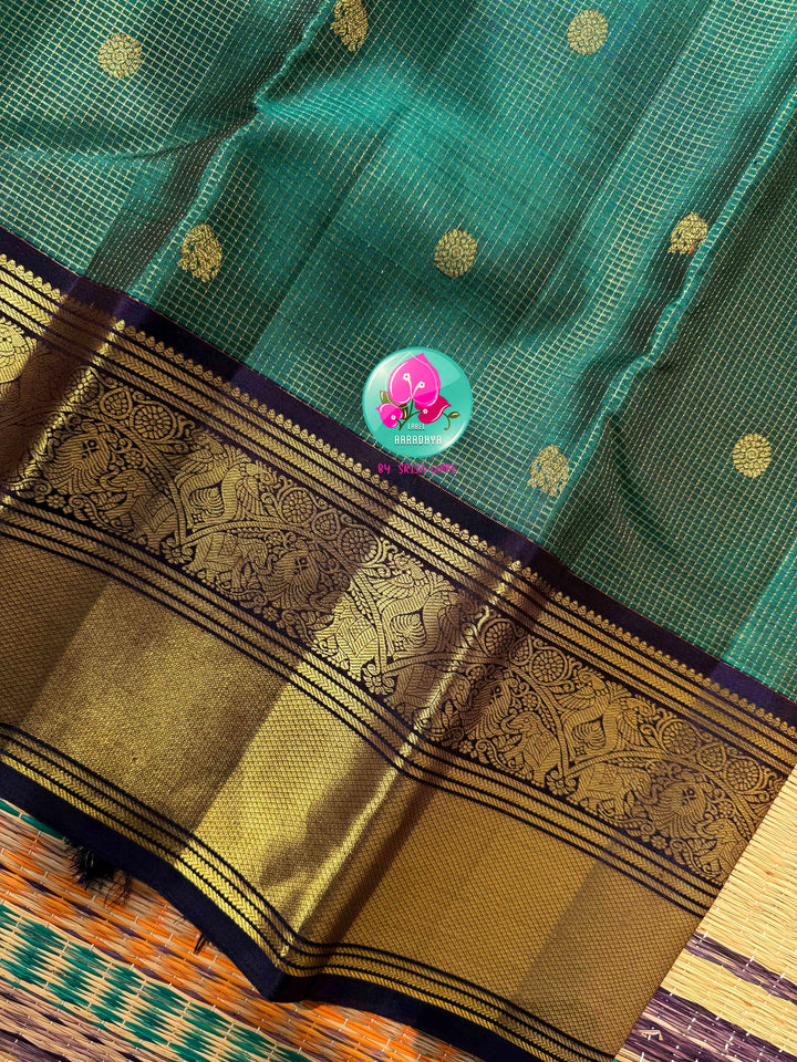 Regal Peacock Radiance & Imperial Purple Grace: Pure Peacock Green Vaira Oosi Kanjeevaram Silk Saree with Dark Purple Hand-Embroidered Blouse