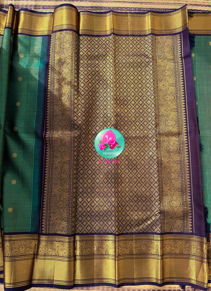 Regal Peacock Radiance & Imperial Purple Grace: Pure Peacock Green Vaira Oosi Kanjeevaram Silk Saree with Dark Purple Hand-Embroidered Blouse