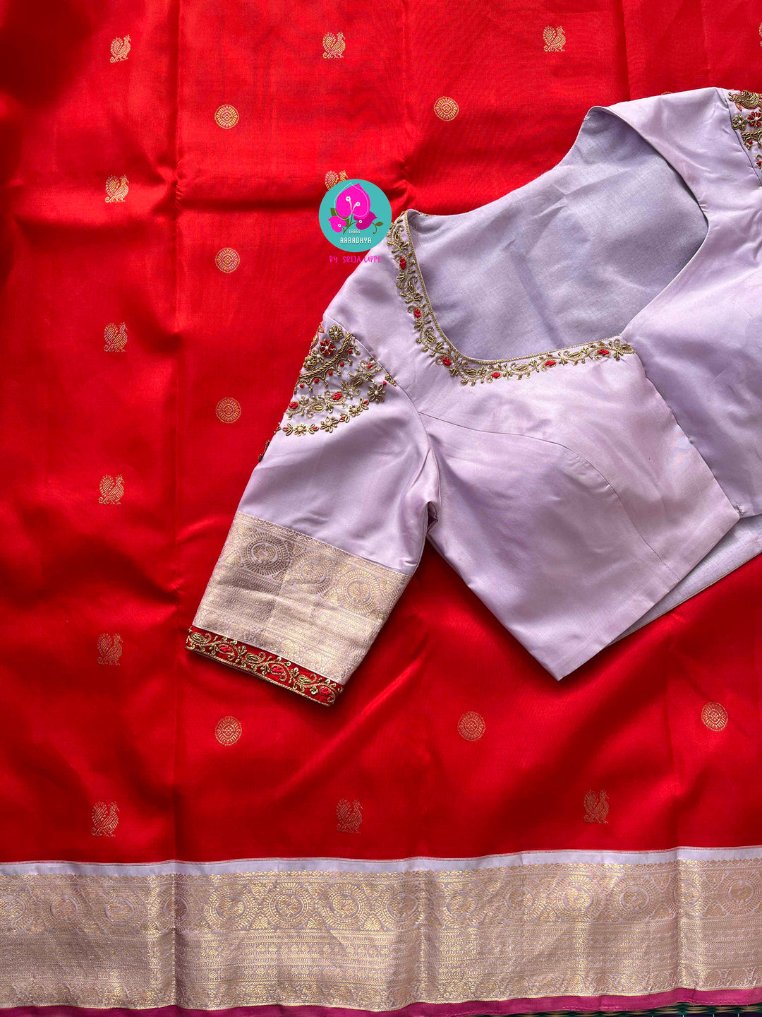 Pure Kanchipattu Red Saree with Hand embroidered Lavender blouse