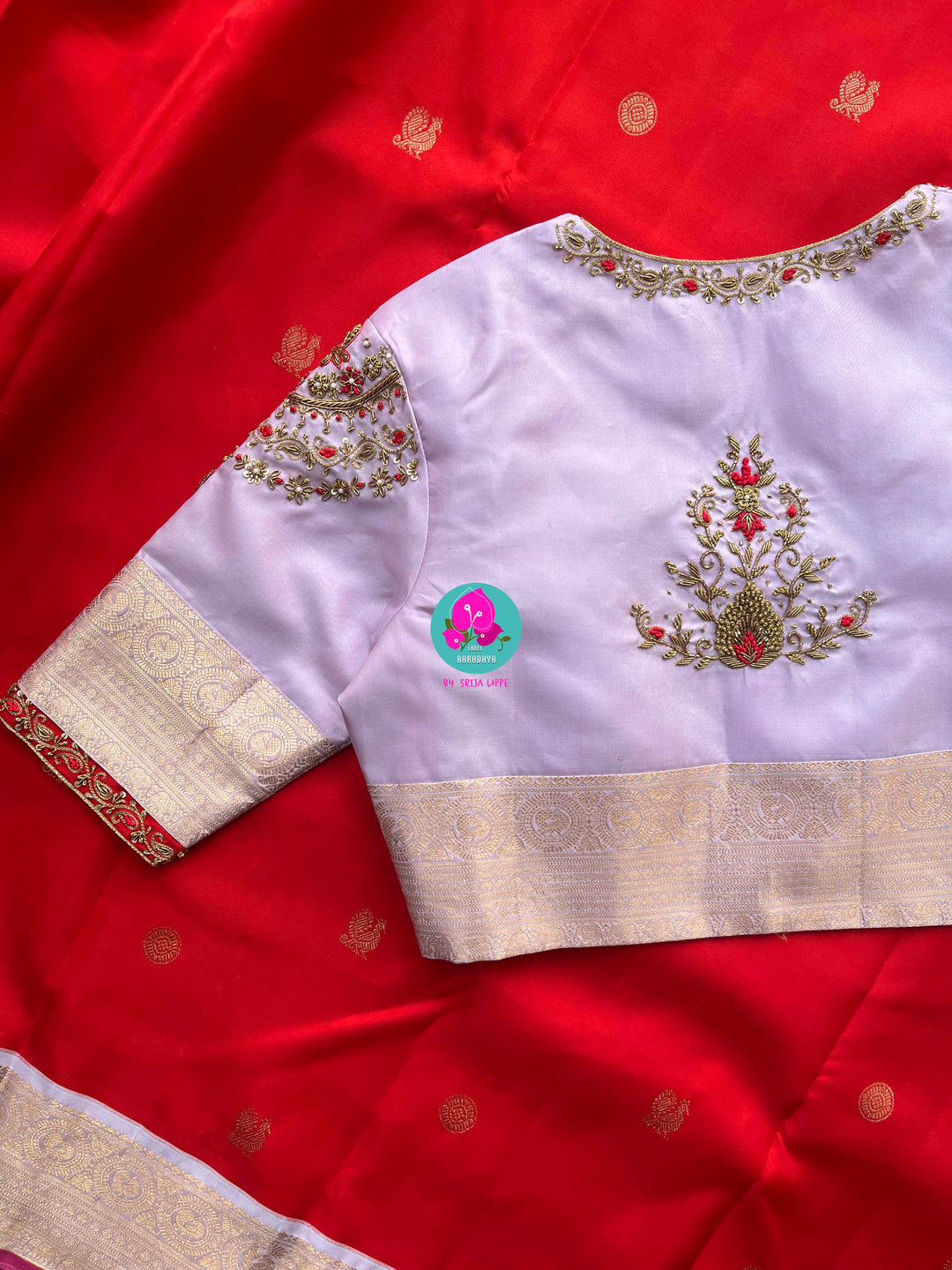 Pure Kanchipattu Red Saree with Hand embroidered Lavender blouse