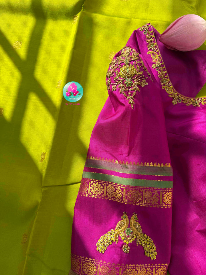 Vibrant Parrot Green Radiance & Rani Pink Magnificence: Pure Kanjeevaram Silk Saree with Peacock-Themed Hand-Embroidered Maggam Blouse