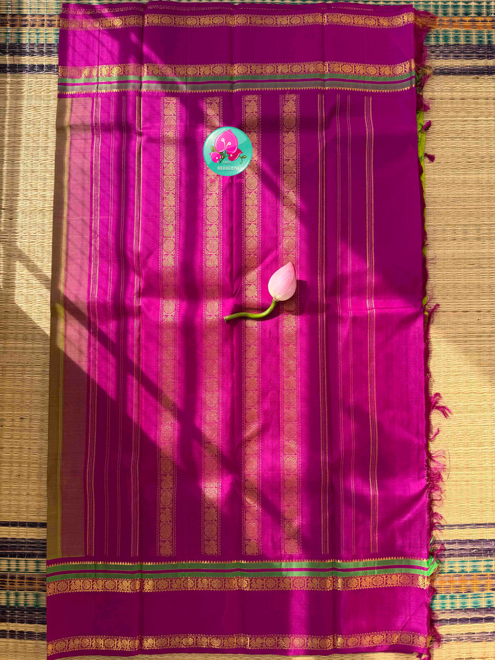 Vibrant Parrot Green Radiance & Rani Pink Magnificence: Pure Kanjeevaram Silk Saree with Peacock-Themed Hand-Embroidered Maggam Blouse