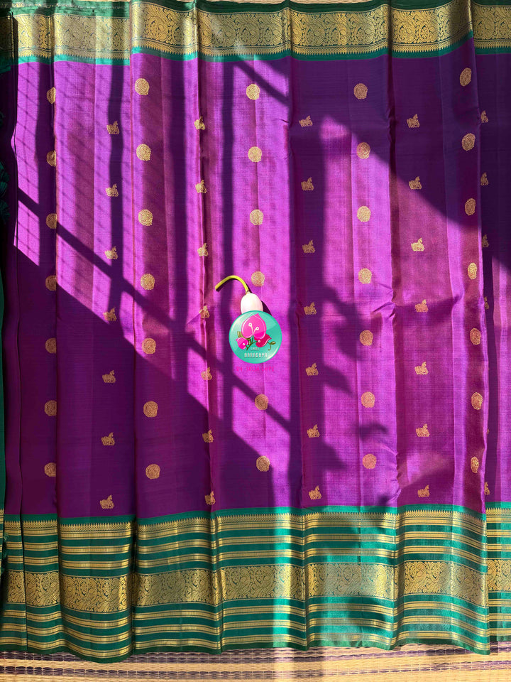 Vintage Regal Splendor: Purplish-Magenta Pure Kanjeevaram Silk Saree with Teal Green Border & Hand-Embroidered Maggam Blouse
