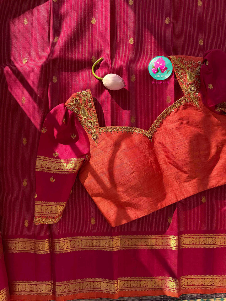 Regal Magenta-Maroon Warmth & Tangerine Radiance: Pure Kanjeevaram Silk Saree with Vaira Oosi Lines, Orange Korvai Border & Fusion Hand-Embroidered Blouse