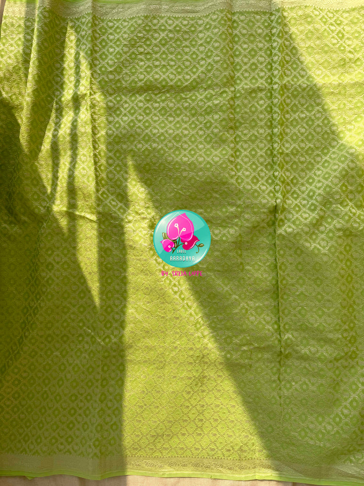 Verdant Radiance: Parrot Green Banarasi Khaddi Georgette Saree with Nandhini Grace with hand embroidered blouse