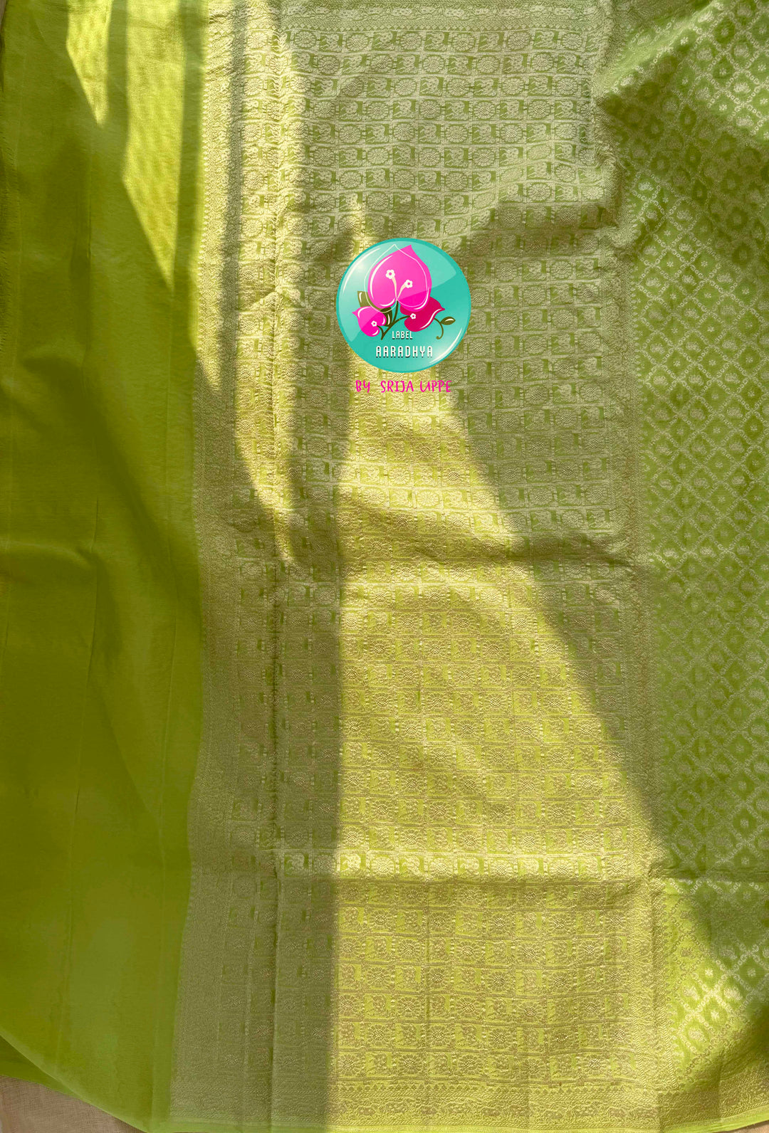 Verdant Radiance: Parrot Green Banarasi Khaddi Georgette Saree with Nandhini Grace with hand embroidered blouse